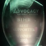 Photo of glass National Advocacy Award with "BIHR Best Supporter Winner 2023" etched on 