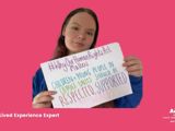 Image of woman holding sign saying "#WhyOurHumanRightsActMatters: Children + young people in CAMHS units should be respected, supported and empowered"