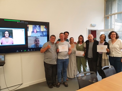 Picture of BIHR Human Rights Officers and SRC members smiling and holding certificates