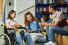 Photo of 4 young people in a college sitting and talking. 