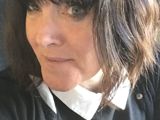 Photo of woman with short, dark hair