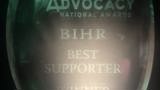 Photo of glass National Advocacy Award with "BIHR Best Supporter Winner 2023" etched on 