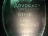 Photo of glass National Advocacy Award with "BIHR Best Supporter Winner 2023" etched on 