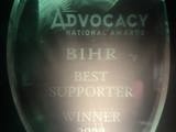 Photo of glass National Advocacy Award with "BIHR Best Supporter Winner 2023" etched on